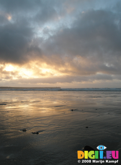 JT00128 Sunrise over pebble on Tramore beach (Brownstown head) levelled